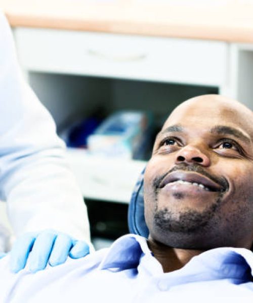 A relaxed and contented dental patient smiles up at the unseen dentist.